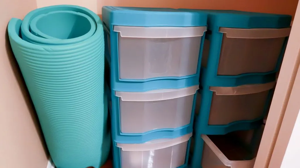 empty drawers and yoga mat inside master bedroom closet