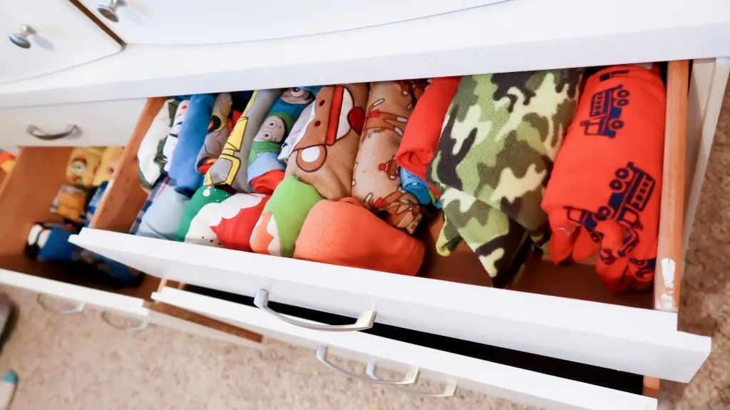 horizontal shot of neatly folded pajamas in kids drawers