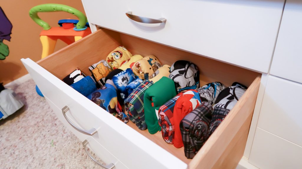 kids pajamas folded in drawer neatly and vertically