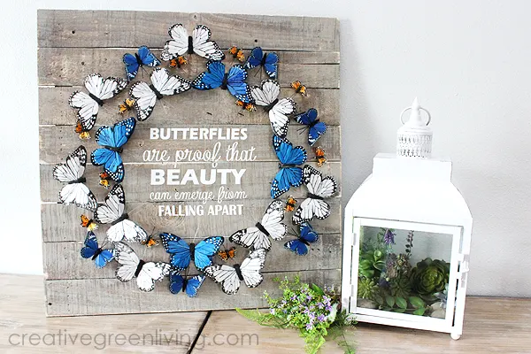 Farmhouse style butterfly decor ideas - indoor wreath on a pallet board with saying 'butterflies are proof that beauty can emerge from falling apart' from CreativeGreenLiving -- SlayAtHomeMother.com
