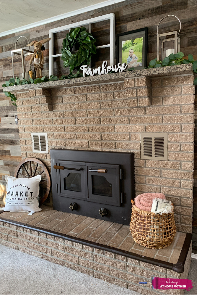 My dark tan fireplace BEFORE painting, decorated with farmhouse decor