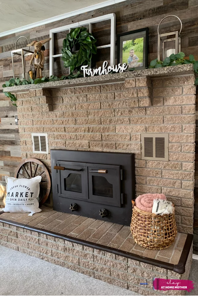 My dark tan fireplace BEFORE painting, decorated with farmhouse decor