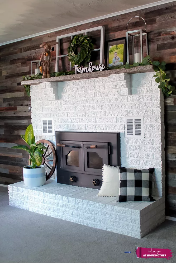 AFTER shot of our white fireplace decorated with farmhouse decor