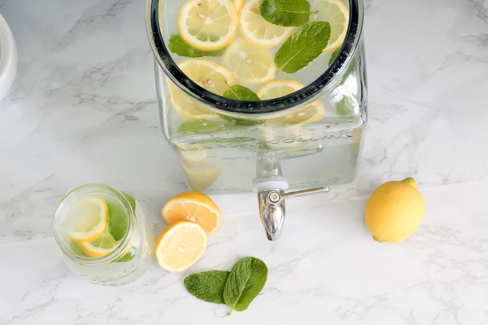 A variety of citrus cocktails vintage glass mason jars with mint