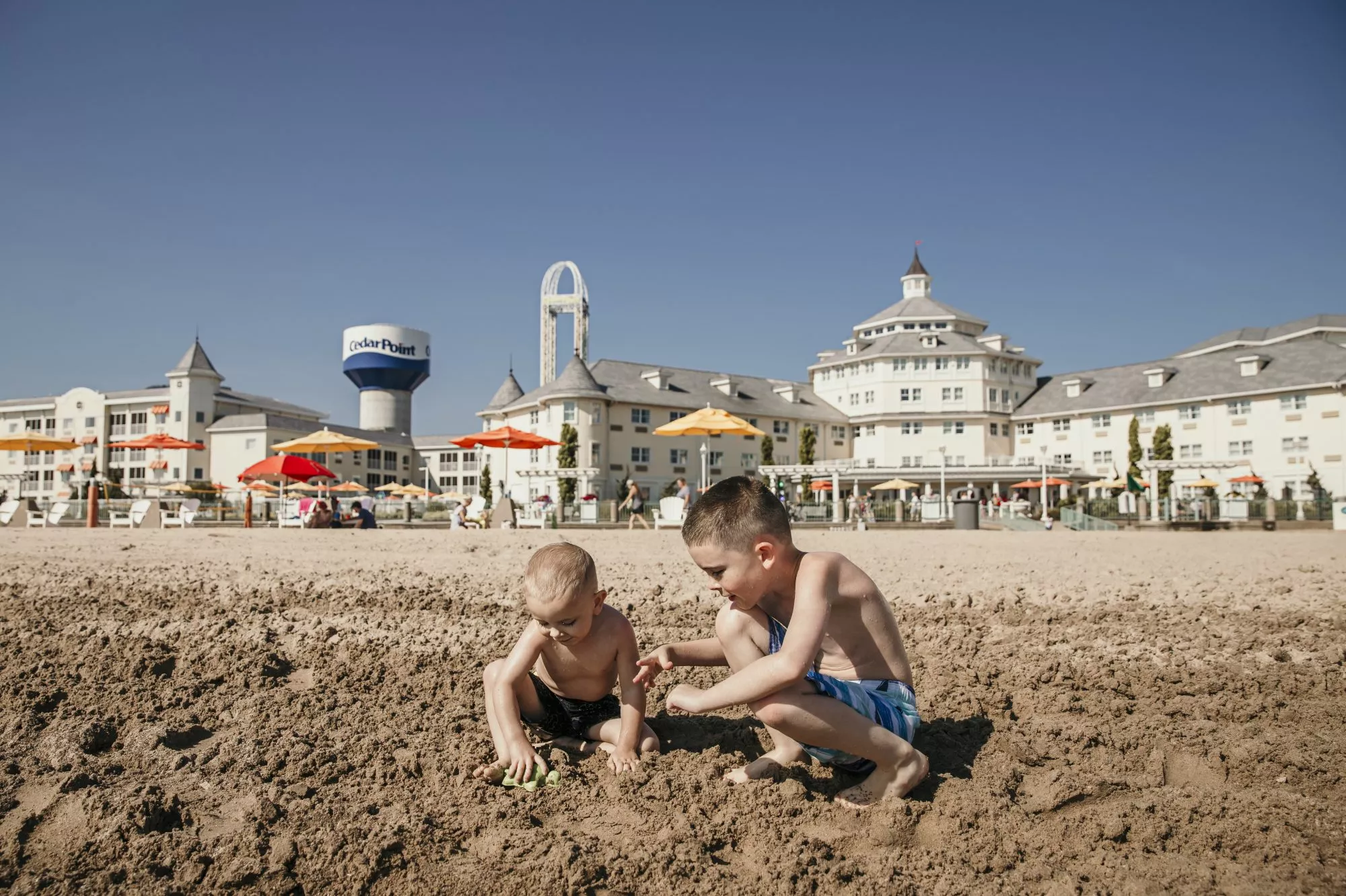 playing in the sand at hotel breakers in cedar point