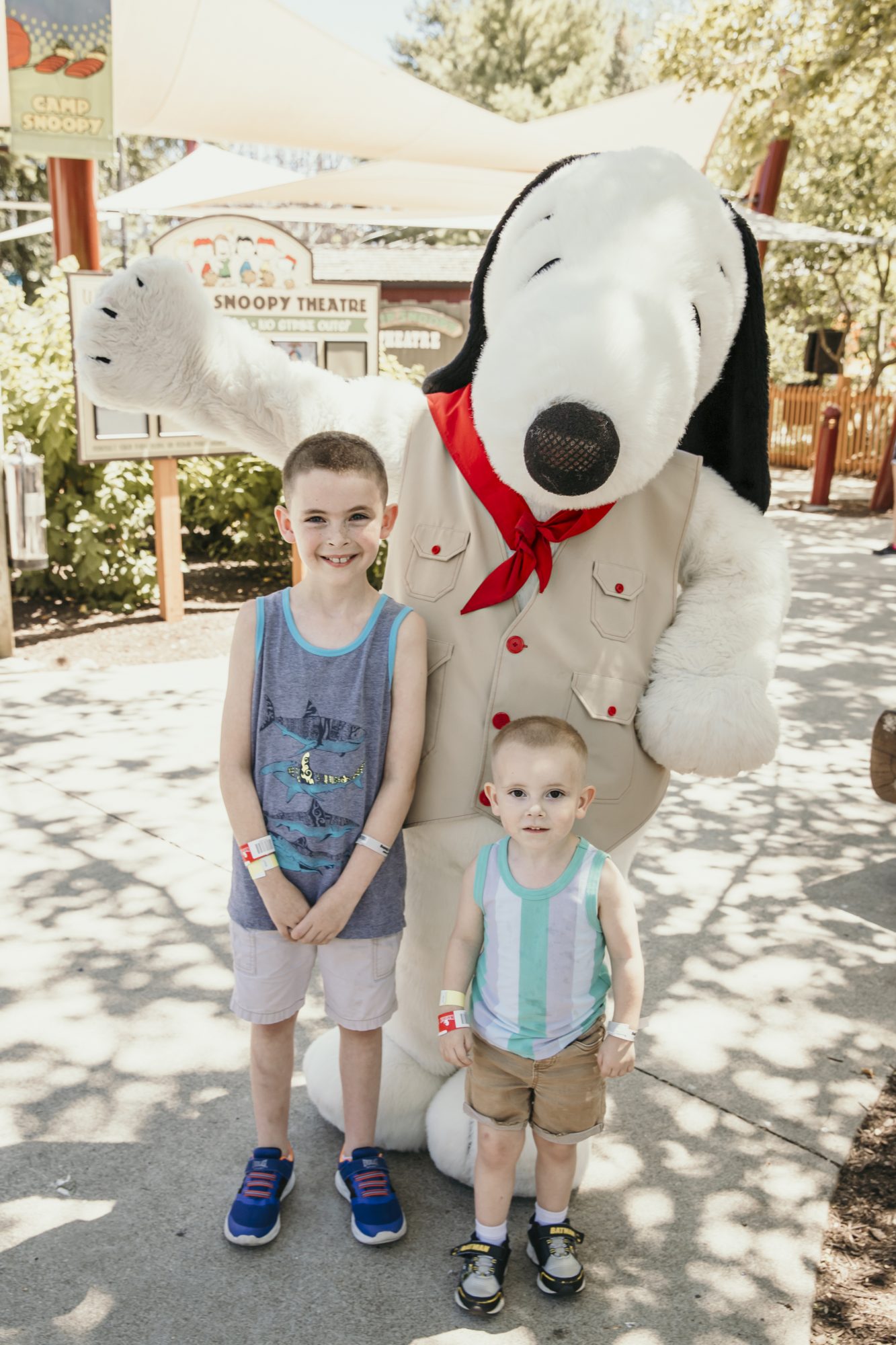 the boys posing with snoopy in cedar point