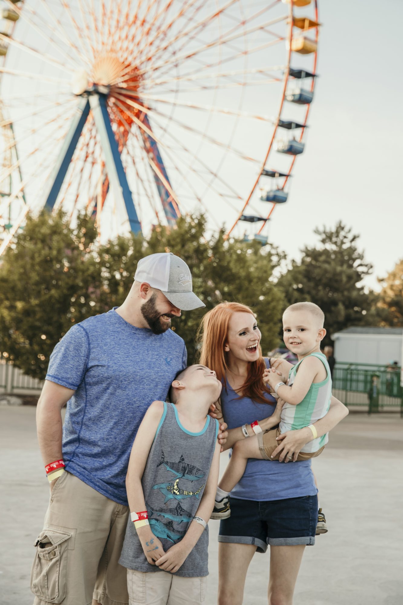 our family smiling in front of the ferris wheel at cedar point