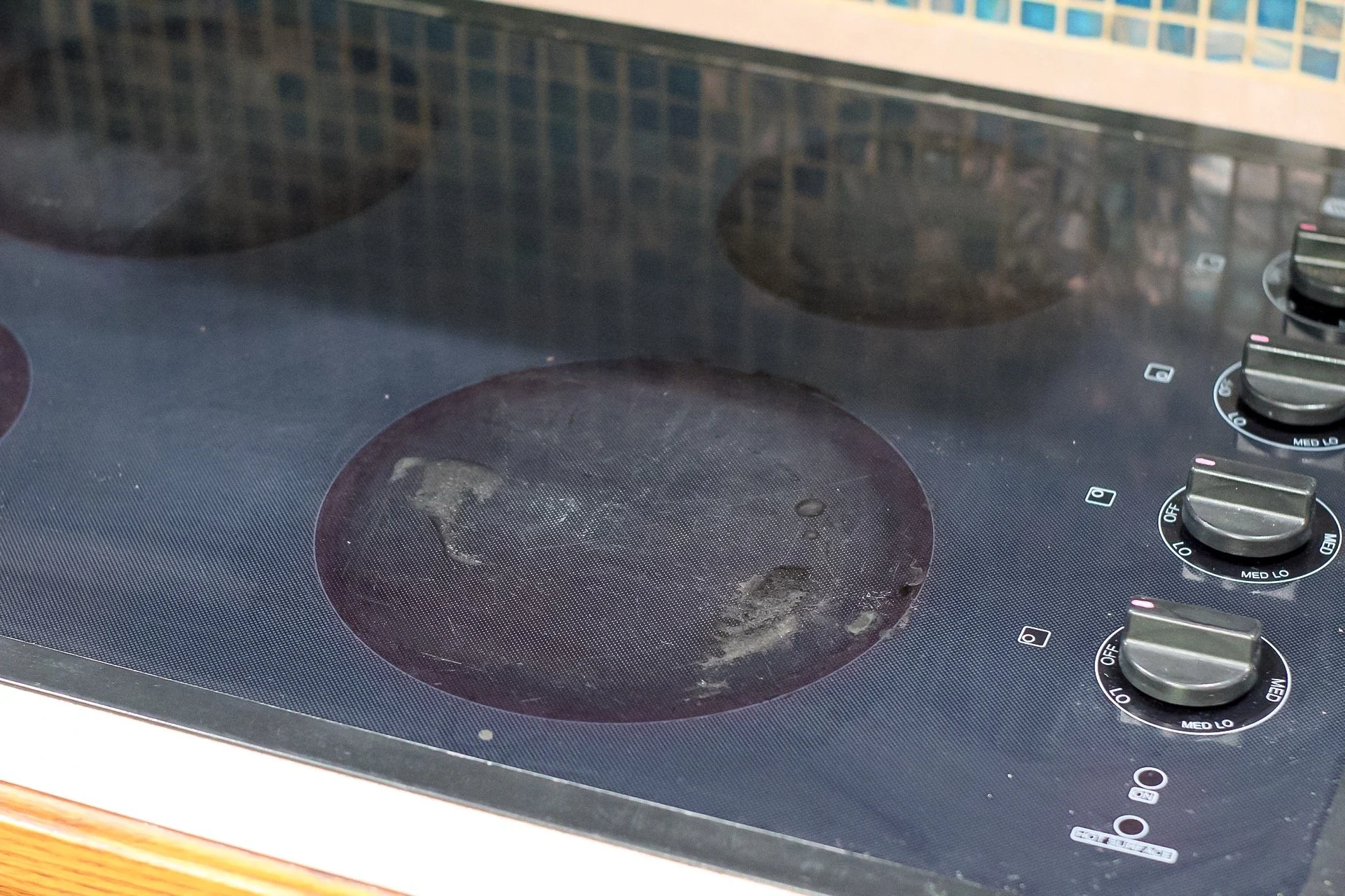 how to clean a black stove top