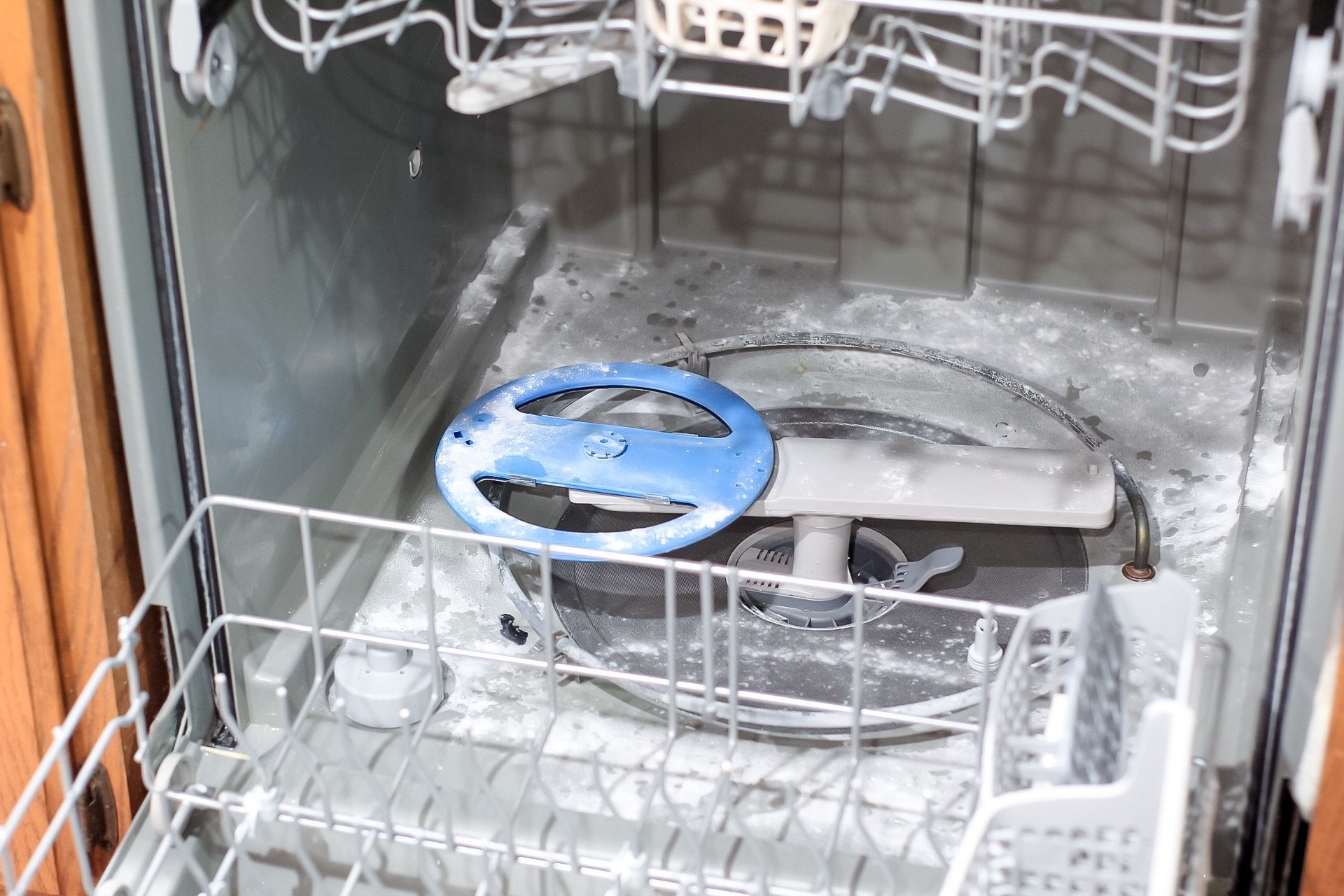 inside dishwasher sprinkled with baking soda