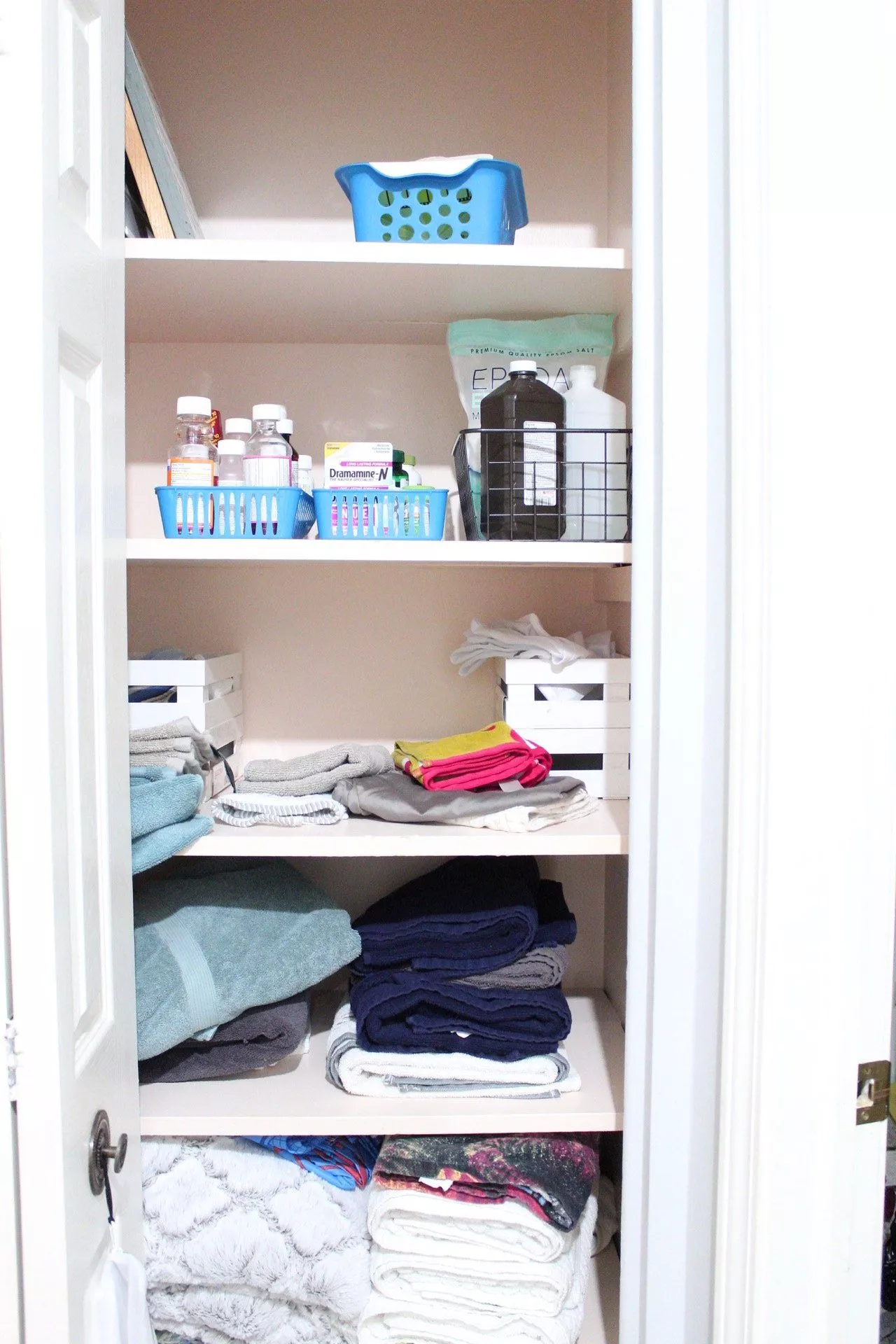 Linen Closet Organization with Baskets: A simple way to eliminate visual  clutter - Organizing Moms