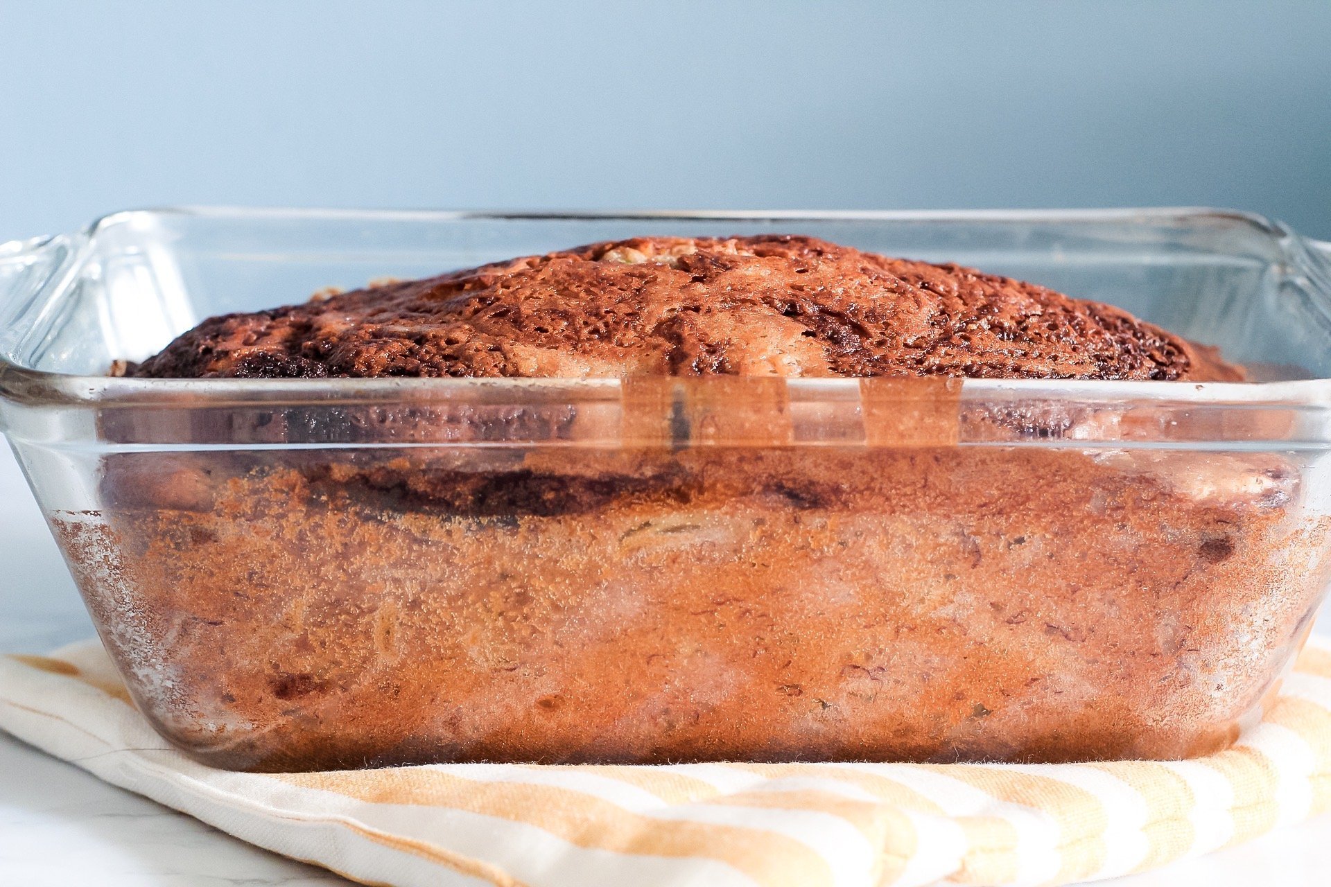 side view of zucchini banana bread in loaf pan