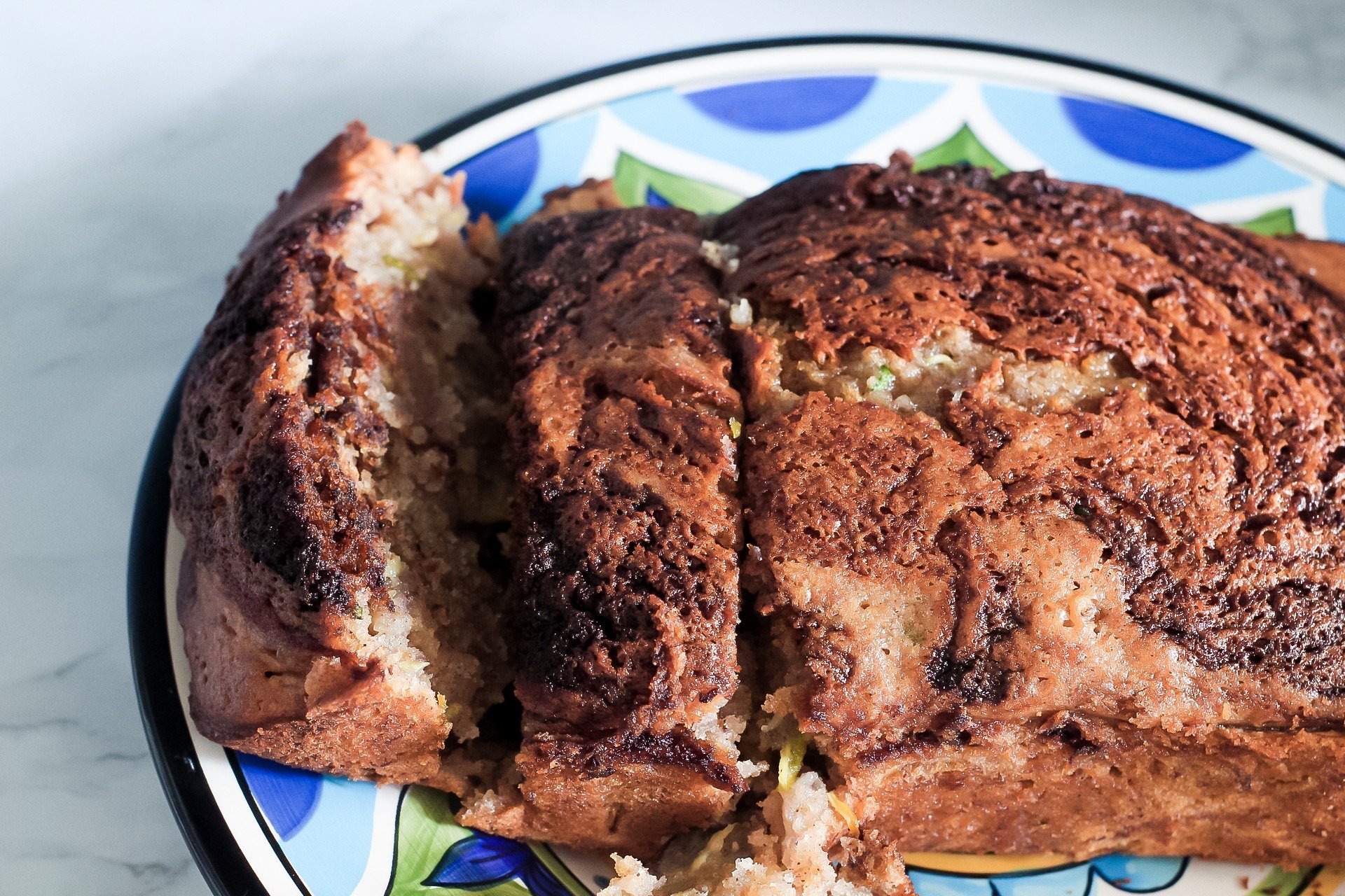 plated and sliced closeup sweet zucchini banana bread loaf