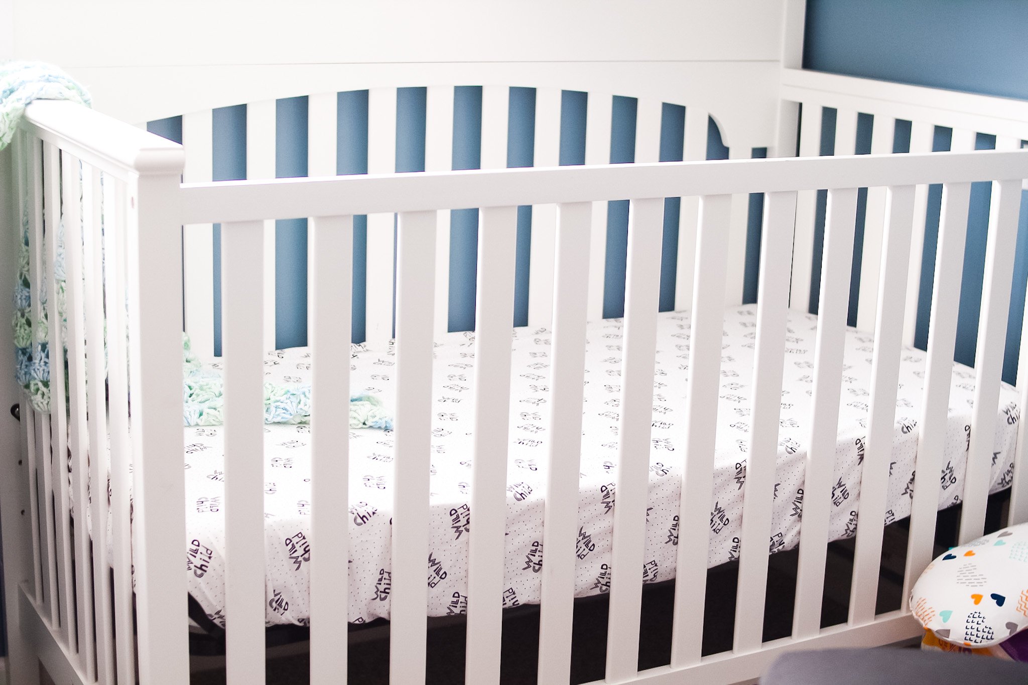 crib sheet on mattress in crib