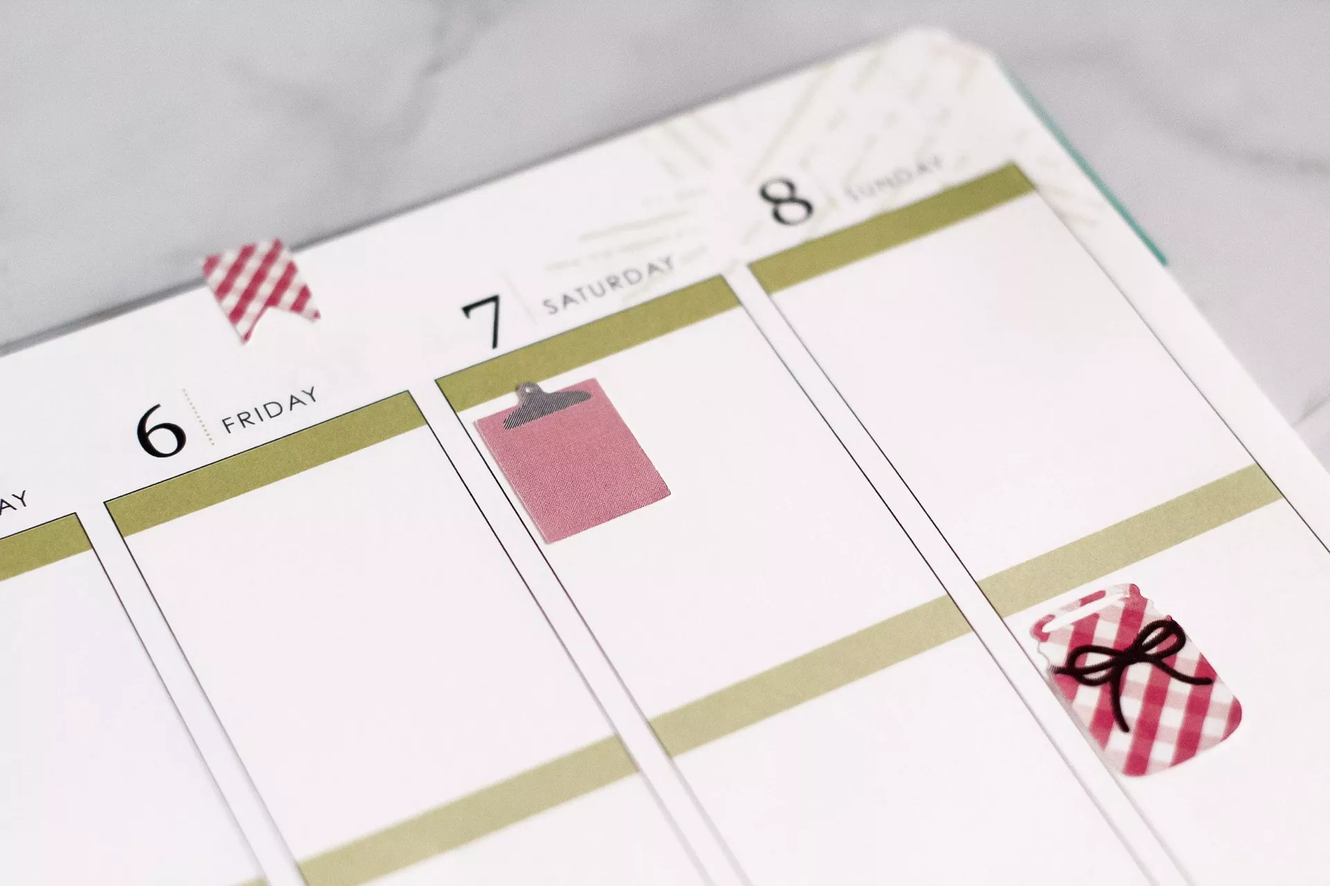 plaid and red stickers on planner page