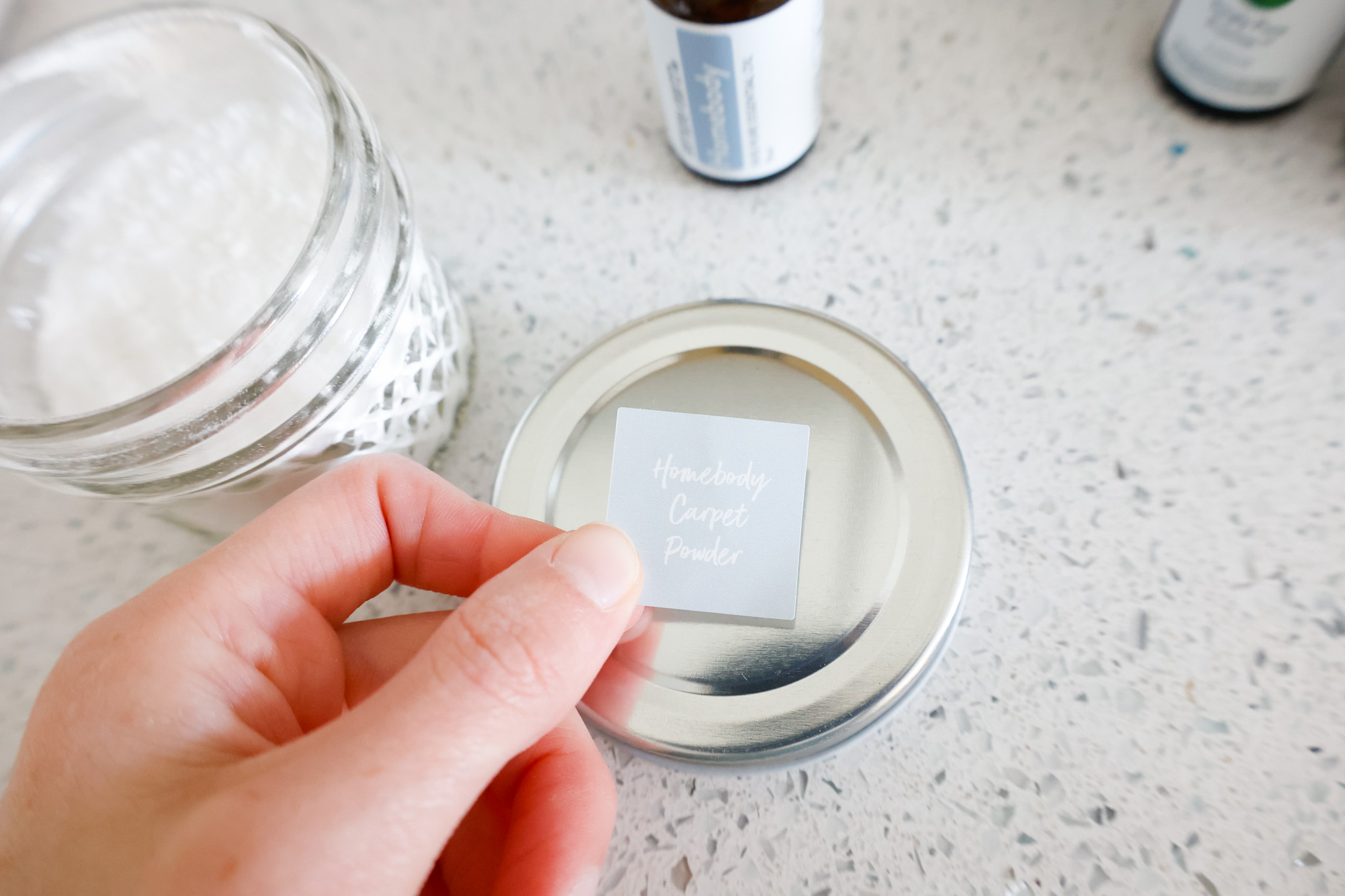 placing sticker label on container for carpet powder