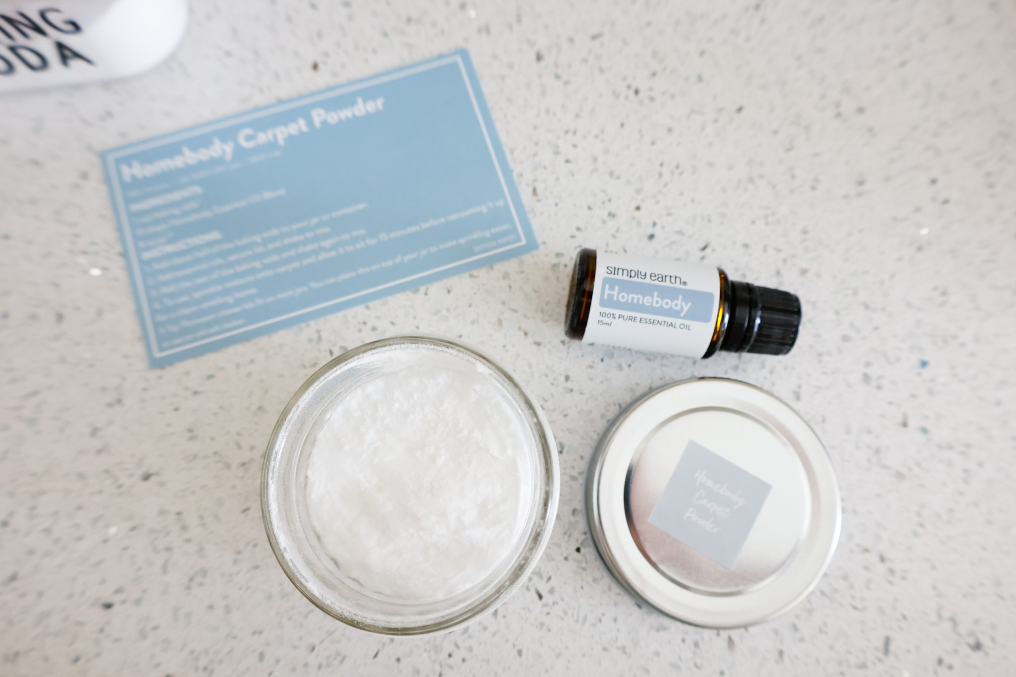 flatlay finished carpet powder recipe with Simply Earth homebody oil blend