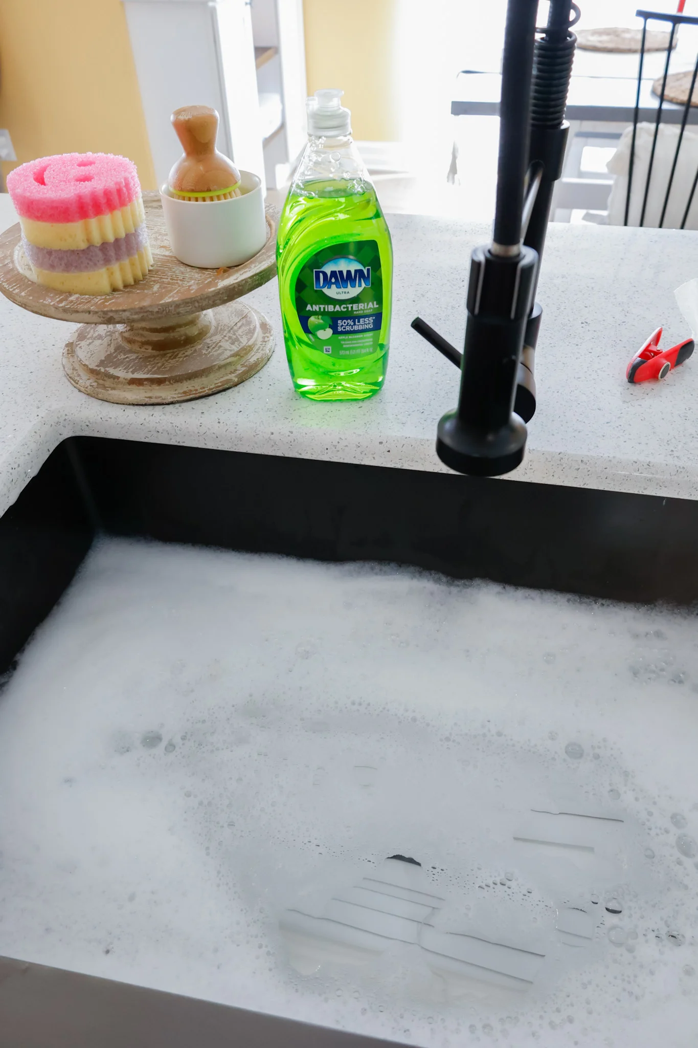 Blinds soaking in water in farmhouse sink