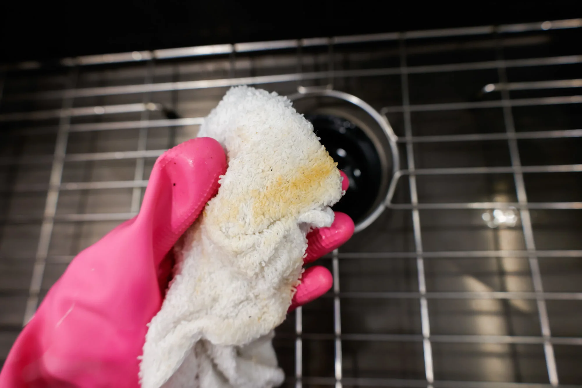 grime on washcloth after wiping garbage disposal folds