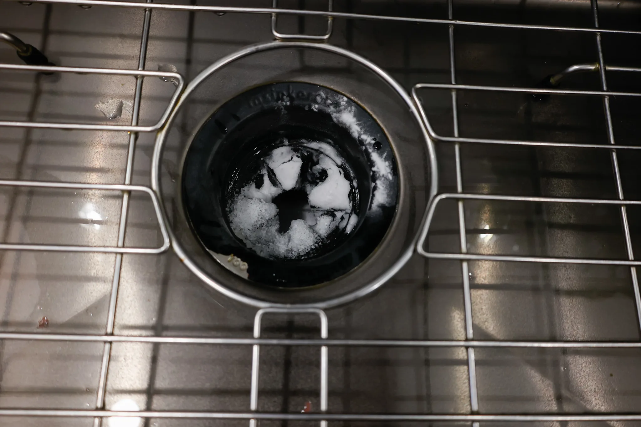 kosher salt poured into garbage disposal