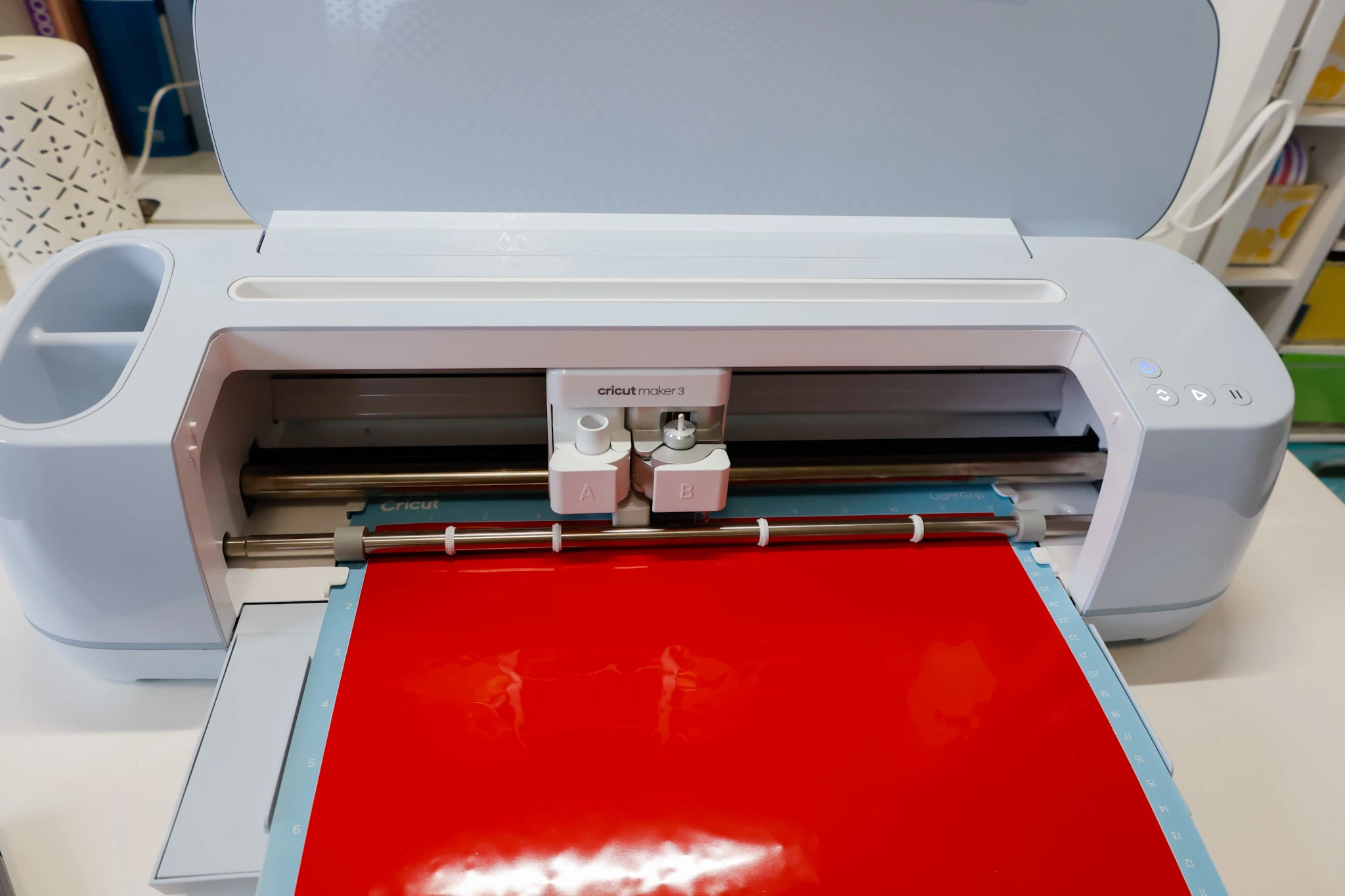 Cricut Maker 3 cutting red permanent vinyl