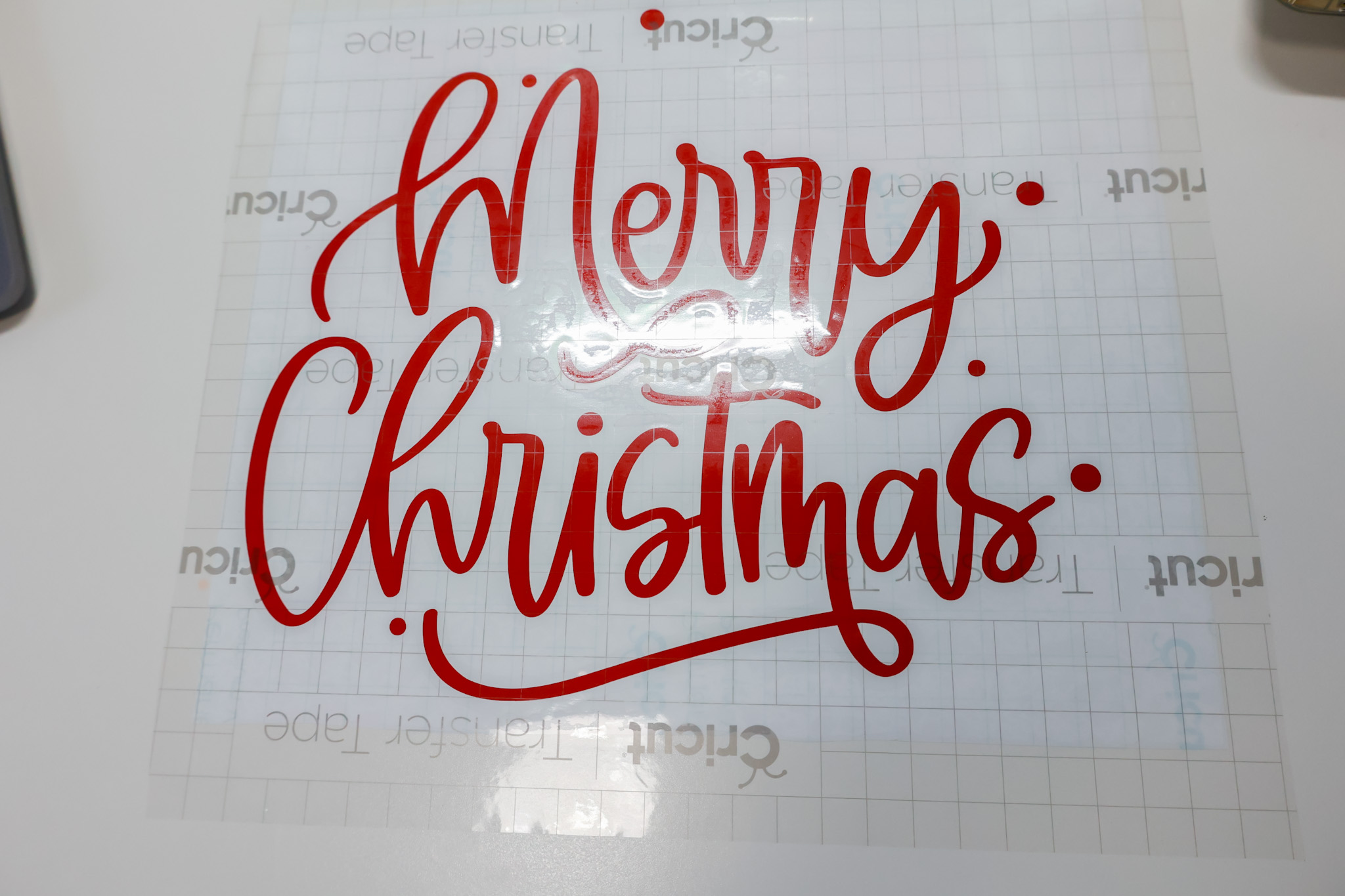 Merry Christmas design in red vinyl on transfer tape