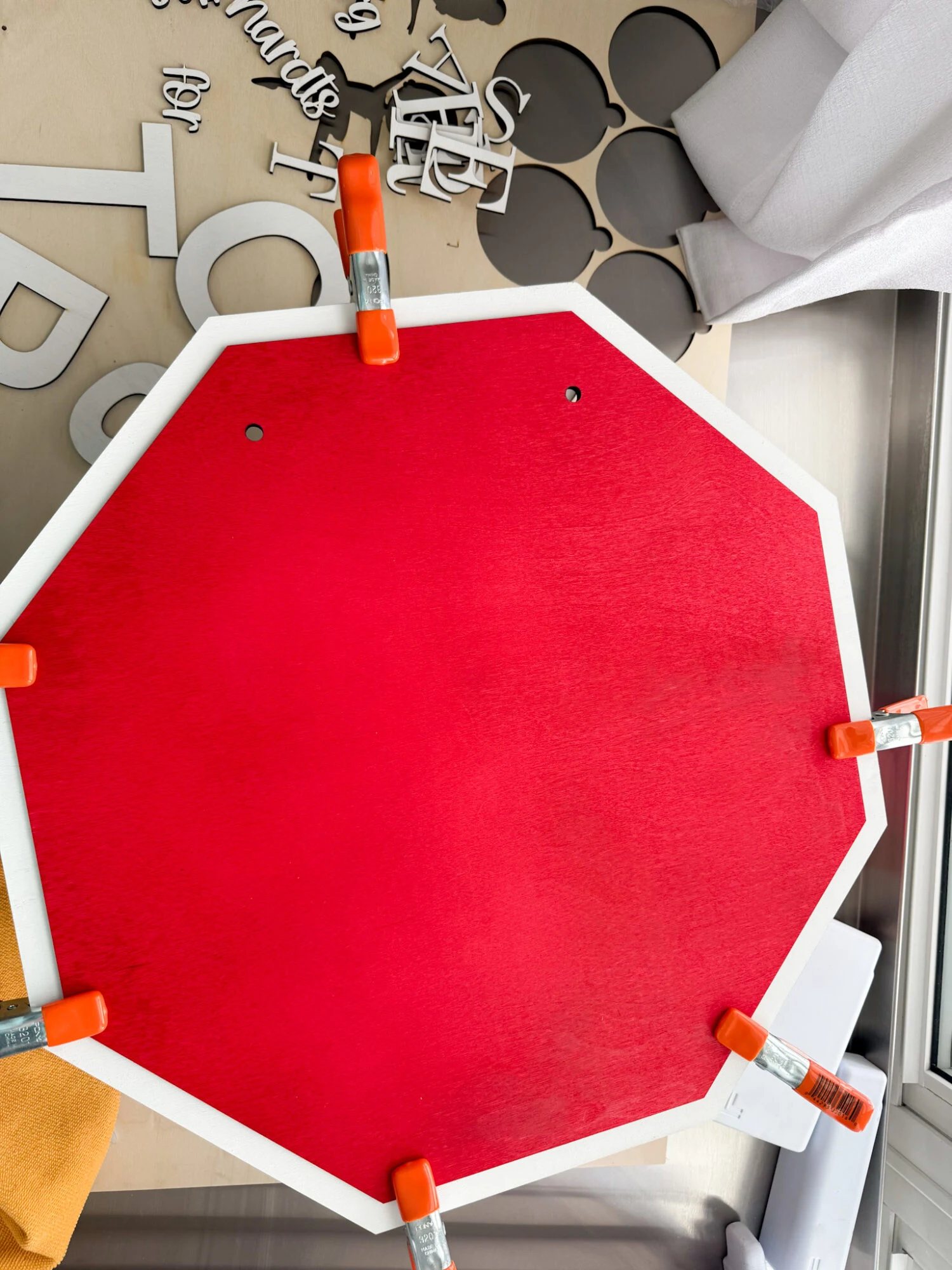 diy santa stop here sign gluing wood together